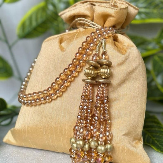 Raw Silk Potli Bags with Heavy Crystal Tassels