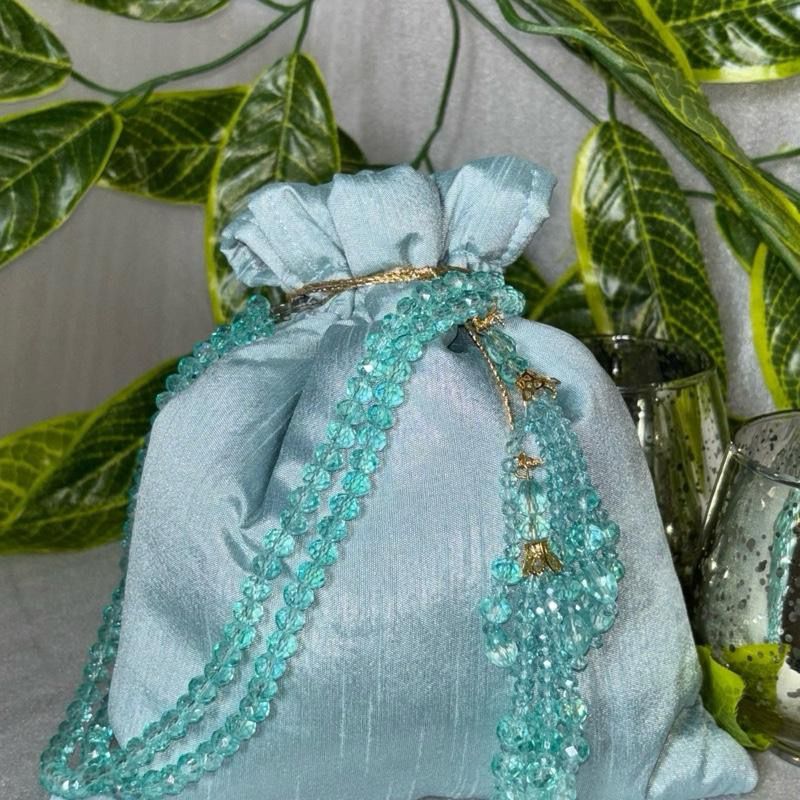 Raw Silk Potli Bags with Heavy Crystal Tassels