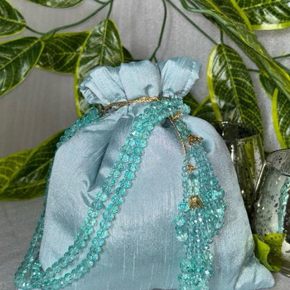 Raw Silk Potli Bags with Heavy Crystal Tassels